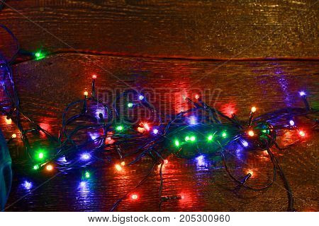 Christmas rustic background - vintage planked wood with lights and free text space.