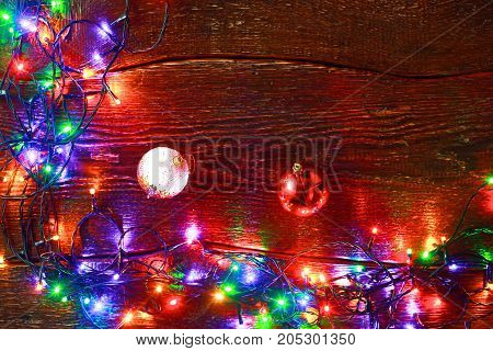 Christmas rustic background - vintage planked wood with lights and free text space.