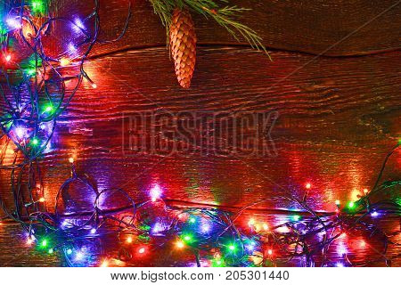 Christmas rustic background - vintage planked wood with lights and free text space.