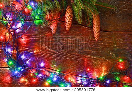 Christmas rustic background - vintage planked wood with lights and free text space.