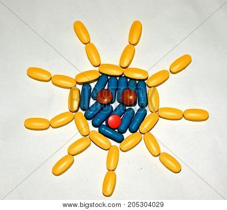 Tablets and capsules are lined in the form of the sun.