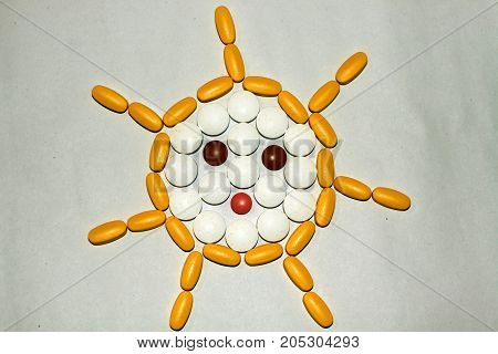Tablets and capsules are lined in the form of the sun.