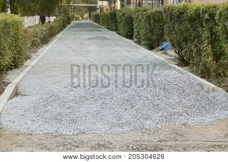 The repair of the road. Pictures of repairing of pedestrian sidewalk. Setting the border