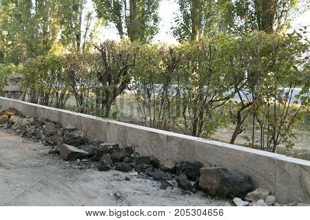 The repair of the road. Pictures of repairing of pedestrian sidewalk. Setting the border