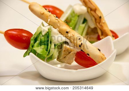A skewers with cherry tomatoes and vegetale