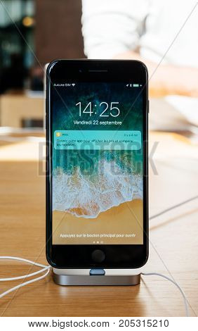PARIS FRANCE - SEP 22 2017: New iPhone 8 and iPhone 8 Plus as well the updated Apple Watch Apple TV goes on sale today in Apple Store with Price app demonstration notification