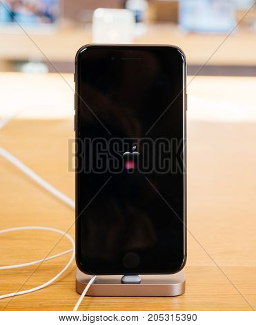 PARIS FRANCE - SEP 22 2017: New iPhone 8 and iPhone 8 Plus Super retina display with vivid red Apple Logo animation on the OLED screen
