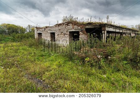 The old destroyed cowshed of the Soviet period in Russia