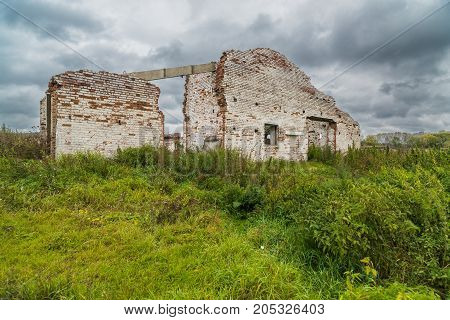The old destroyed cowshed of the Soviet period in Russia