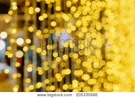Defocused lights abstract golden nonagon bokeh background