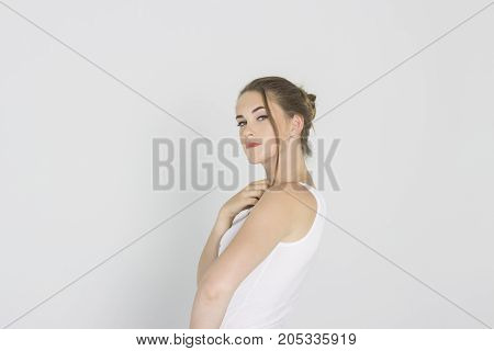 Pretty girl looking with interest on white backgraund