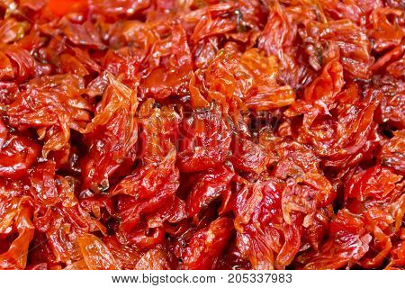 Background of red dry roses as oriental sweets in marketplace