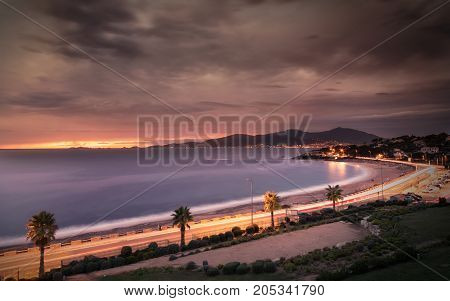 Sunset And Stormy Clouds Over Porticcio Beach In Corsica