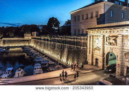 ZADAR, CROATIA - JULY 15, 2017: Tourists on the streets in the evening in the city of Zadar.
