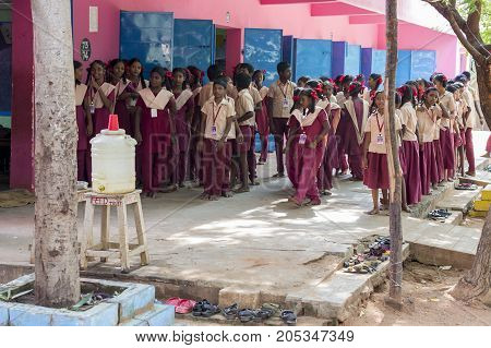 PONDICHERY PUDUCHERY INDIA - SSEPTEMBER 04 2017. School parade of each monday morning with children students in uniforms. They walk sing and pray before going in the classrooms.