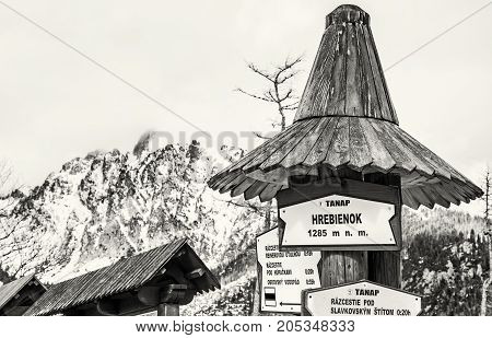 Hiking signs in Hrebienok High Tatras mountains Slovak republic. Winter natural scene. Tourism theme. Black and white photo.