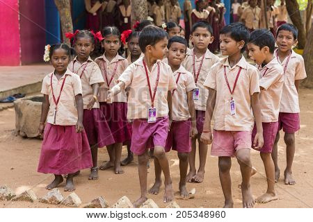 PONDICHERY PUDUCHERY INDIA - SSEPTEMBER 04 2017. School parade of each monday morning with children students in uniforms. They walk sing and pray before going in the classrooms.