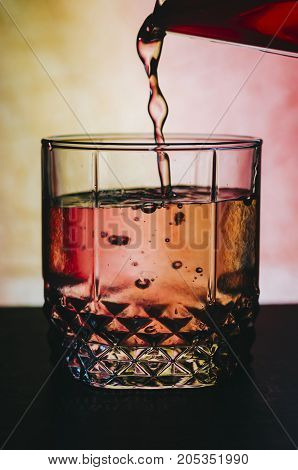 Red alcohol cocktail on the bar table