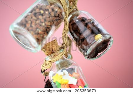 Collection of grain products, lentils, soybeans and red beans in storage jars over on free background