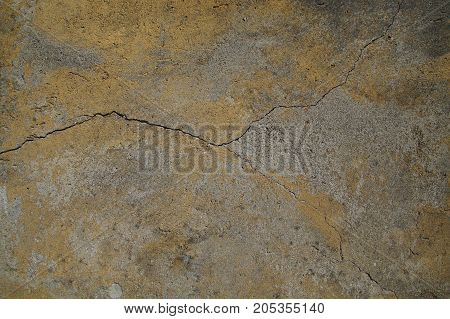 Cracked concrete wall covered with cement - background