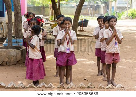 PONDICHERY PUDUCHERY INDIA - SSEPTEMBER 04 2017. School parade of each monday morning with children students in uniforms. They walk sing and pray before going in the classrooms.