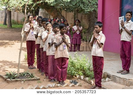 PONDICHERY PUDUCHERY INDIA - SSEPTEMBER 04 2017. School parade of each monday morning with children students in uniforms. They walk sing and pray before going in the classrooms.