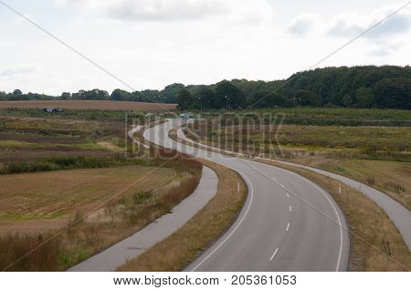 Road with bike path in area of Naestved in Denmark
