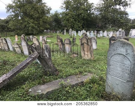 Teresva, Ukraine, September 18, 2017; An Old Jewish Cemetery. Shattered Gravestones Stand Among The