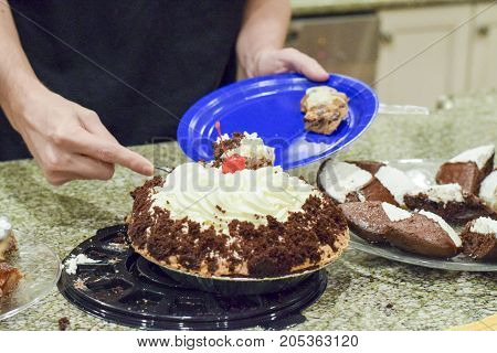 Hand Cutting Warm Whipped Cream Chocolate Pie