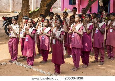 PONDICHERY PUDUCHERY INDIA - SSEPTEMBER 04 2017. School parade of each monday morning with children students in uniforms. They walk sing and pray before going in the classrooms.