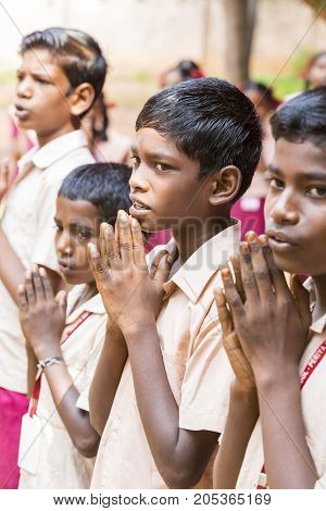 PONDICHERY PUDUCHERY INDIA - SSEPTEMBER 04 2017. School parade of each monday morning with children students in uniforms. They walk sing and pray before going in the classrooms.