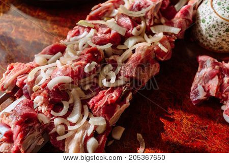 Meat for shish kebab on the kitchen table close up
