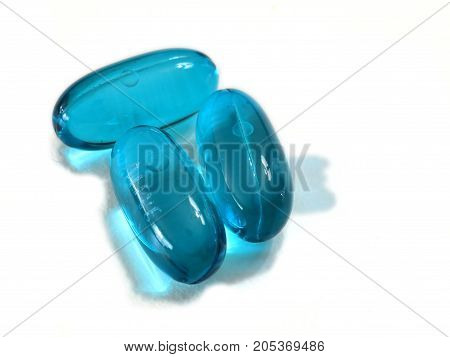 Pills for medical treatment. Pharmaceutical type images showing a verity of pills / capsules.