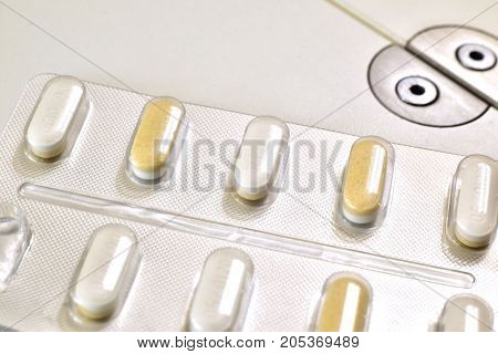 Pills for medical treatment. Pharmaceutical type images showing a verity of pills / capsules.