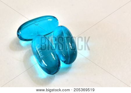Pills for medical treatment. Pharmaceutical type images showing a verity of pills / capsules.
