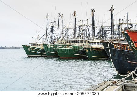New Bedford Massachusetts USA - September 23 2017: Line of moored fishing boats along New Bedford waterfront