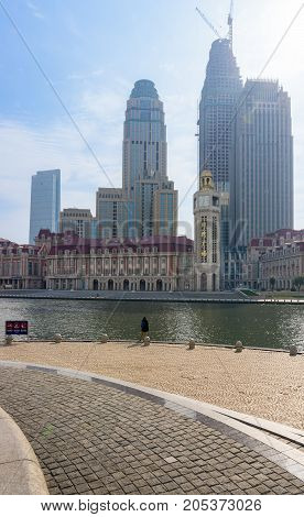 Tianjin, China - Nov 1, 2016: Commercial skyline across the Haihe River. Buildings in contrasting modern and old architectural style.