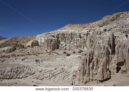 Eroded rock formations along Quebrada Chuba, a river valley high on the Altiplano of northern Chile in Lauca National Park.