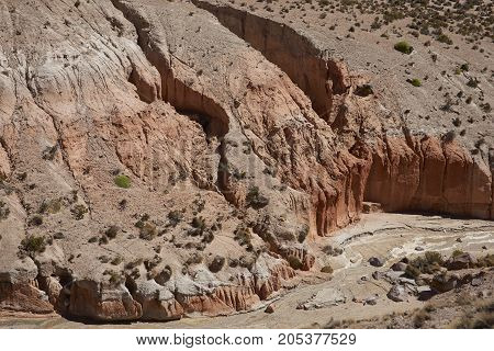 Colourful eroded rock formations along Quebrada Chuba, a river valley high on the Altiplano of northern Chile in Lauca National Park.