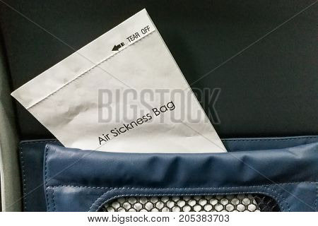 Air Sickness Bag Tucked Behind Airplane Seat Pocket