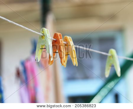 clothespins on a rope. macro . In the park in nature