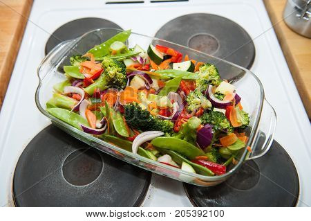 baked vegetables in glass pan on stove