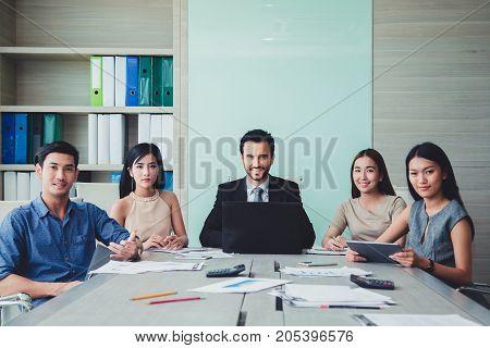 Professional team business smiling at meeting in office