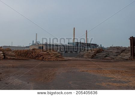 Industrial buildings and tree logs in Koege harbor