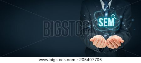 Search engine marketing - SEM concept. Businessman or programmer is focused to improve SEM and web traffic.