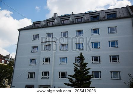 Houses row of houses in Munich blue sky