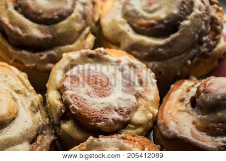 cinnamon bon rolls with frosting on plate