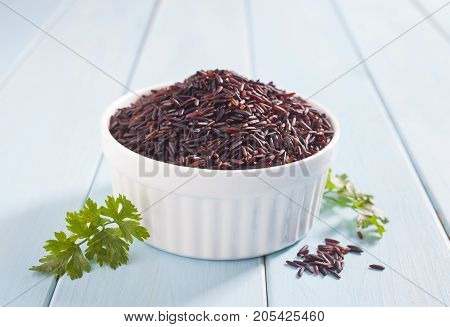Organic black rice bowl. Purple rice or pearl black. Chinese rice