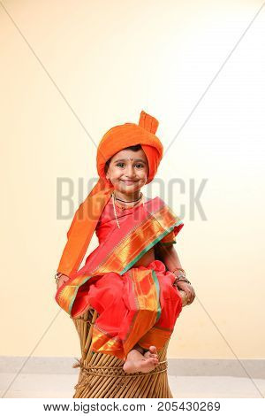 cute indian child in traditional style , posing