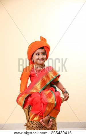 cute indian child in traditional style , posing